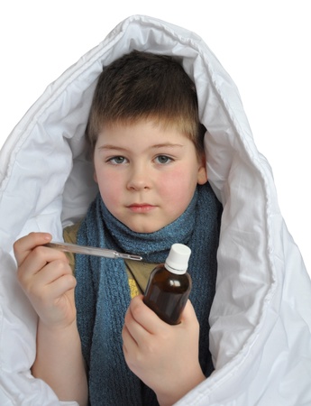Sick boy with a medicine and a thermometer isolated on white backgroundの写真素材