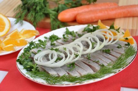Appetizing herring with onions and orangesの写真素材
