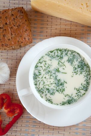 Cheese soup with dill and cereal breadの写真素材