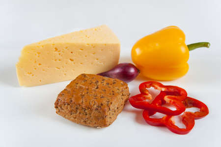 The concept of healthy food - bread with bran, vegetables and cheese on a light backgroundの写真素材