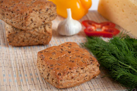 A delicious, whole grain bread and bran - the concept of healthy eatingの写真素材