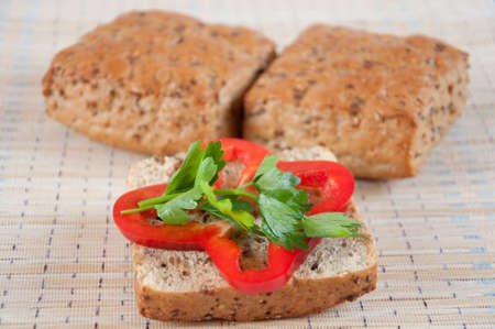 The concept of healthy eating - whole grain bread with vegetablesの写真素材