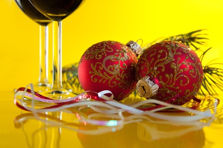 New Year's still life - glasses of wine and Christmas ballsの写真素材