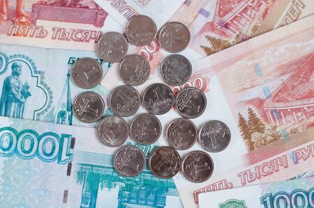 Russian Kopeck on background of large banknotesの写真素材