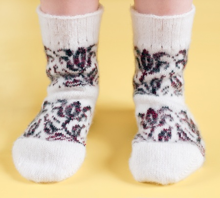children's feet in wool socksの写真素材