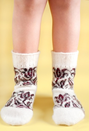 children's feet in wool socksの写真素材