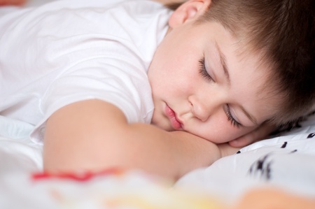 The boy was asleep on a pillow with Chinese charactersの写真素材