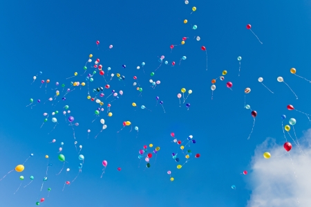 Colorful balloons on a blue sky backgroundの写真素材