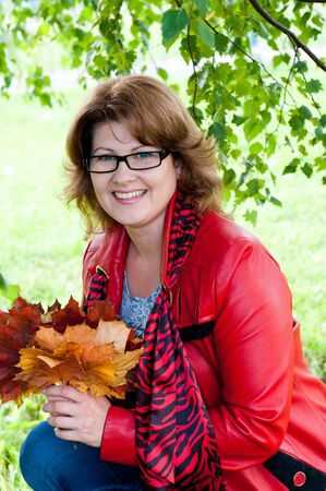 Woman with glasses in the parkの写真素材