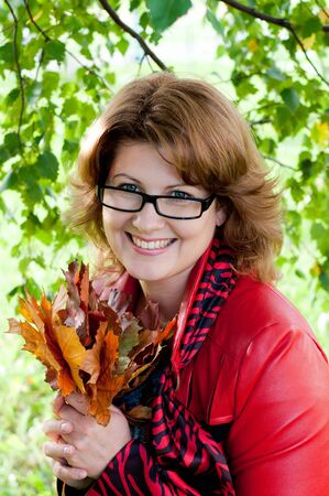 Woman with glasses in the parkの写真素材