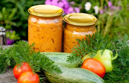 canned vegetables zucchini in a glass jarの写真素材