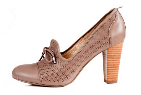Beige female shoes isolated on whiteの写真素材