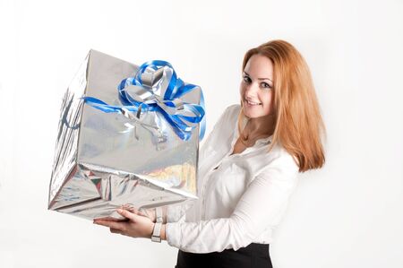 The girl with a gift on a light backgroundの写真素材