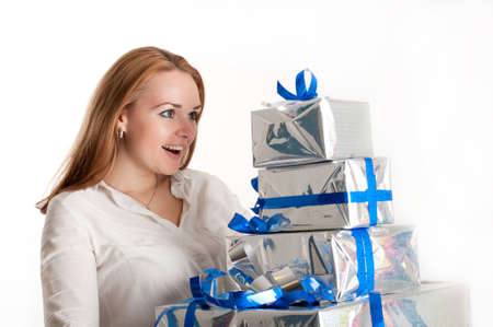 The girl with a gift on a light backgroundの写真素材