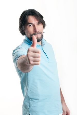 Man shows a sign of okay on a light backgroundの写真素材