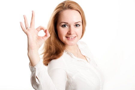 The girl shows a sign on the fingersの写真素材