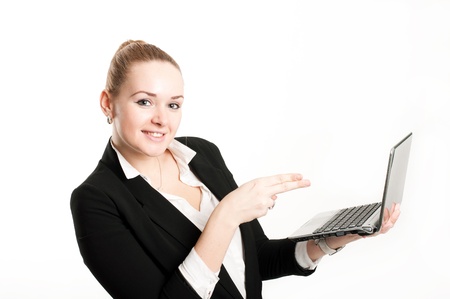 Woman with laptop on a light backgroundの写真素材