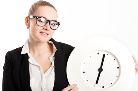 Business woman with a clock on a light backgroundの写真素材