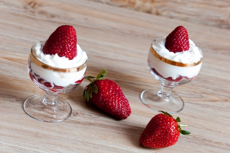 A delicious dessert of strawberries with creamの写真素材