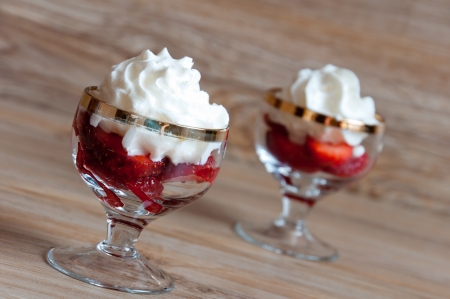 A delicious dessert of strawberries with creamの写真素材