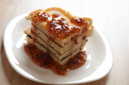 A stack of pancakes with jam gooseberryの写真素材