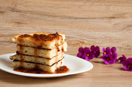 A stack of pancakes with jam gooseberryの写真素材