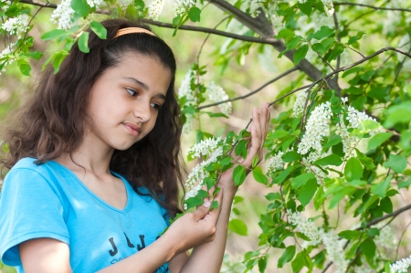 Girl with cherry blossoms treeの写真素材