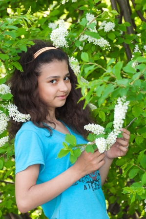 Girl with cherry blossoms treeの写真素材