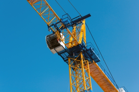 Construction crane against the skyの写真素材