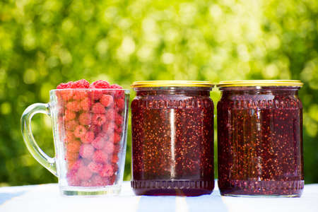 Raspberry jam and fresh berriesの写真素材