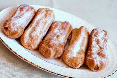 Appetizing eclairs with custard