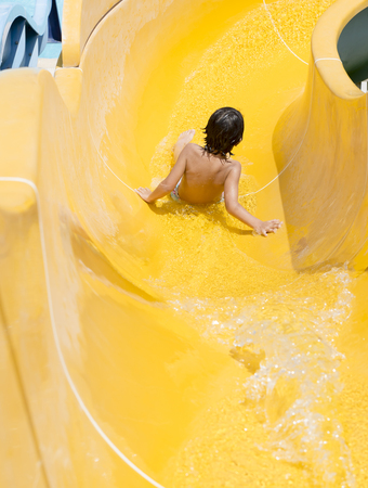 A Children play on the water slideの写真素材