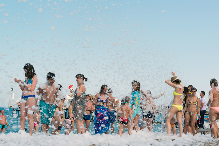 Kemer, Turkey-August 21, 2014. Foam Party on a resort. Group of people enjoying in drinking, dancing and music.のeditorial素材