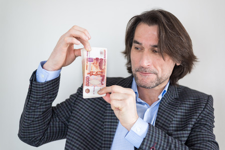 man with Russian money in his hands