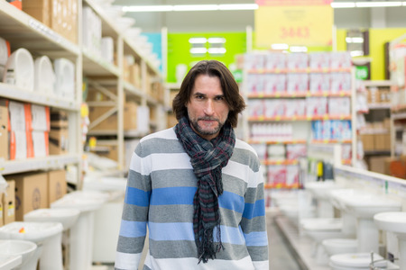 Portrait of a middle-aged man in a store building materialsの写真素材