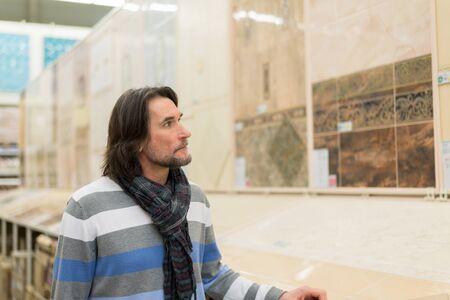 Portrait of a middle-aged man in a store building materialsの写真素材