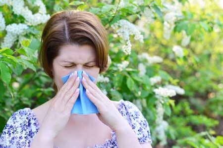 adult female with allergic rhinitis about a bird cherry blossomsの写真素材