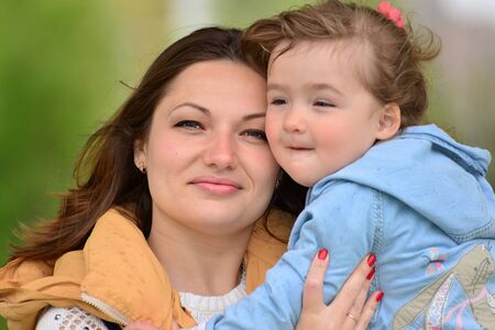 Portrait of a mother with her daughter 2.5 years for a walkの写真素材