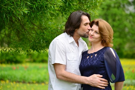 Adult male and female in a park in springの写真素材