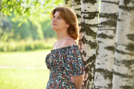 a woman in a dress with open shoulders is about Birchの写真素材