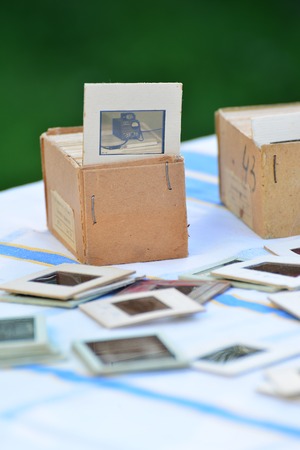 Many old slides on the table in the gardenの写真素材