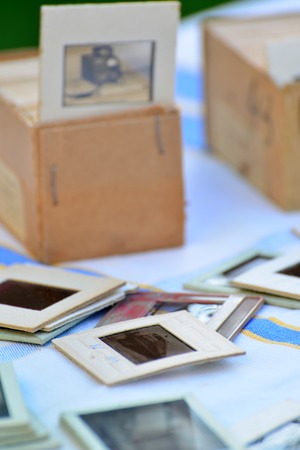 Many old slides on the table in the gardenの写真素材