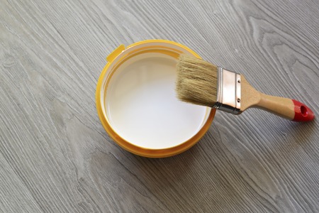 Bank with white paint and brush on the floorの写真素材