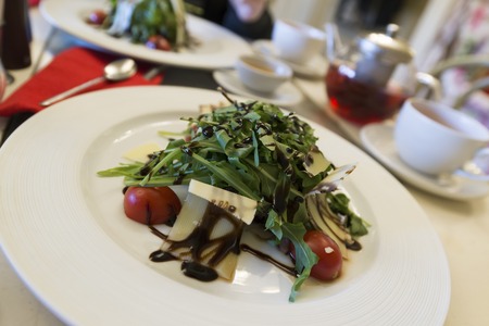 A Warm salad with beef and arugulaの写真素材