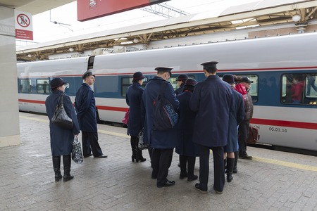 MOSCOW, RUSSIA -01.11.2015. Conductor worth about High-speed train at a Kursky stationのeditorial素材
