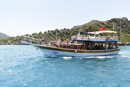 Kemer, Turkey - 06.20.2015. Boat with tourists near the coast of Turkeyのeditorial素材