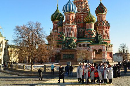 Moscow, Russia -February 18.2016. Tourists are photographed against the backdrop of St a Basil's Cathedralのeditorial素材