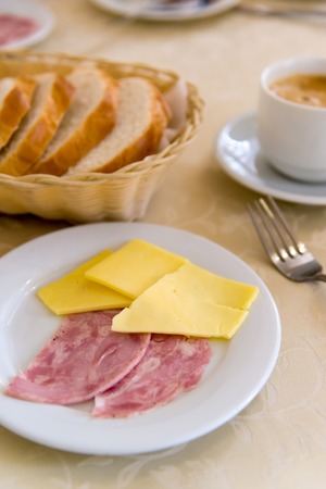 breakfast with with cheese and sausage on the table in a cafeの写真素材