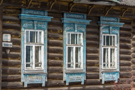 Carved window in an old russian wooden country houseの写真素材