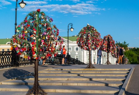 MOSCOW, RUSSIA - 21.09.2015. Trees with locks of lovers on a trees at Tretyakovsky bridgeのeditorial素材